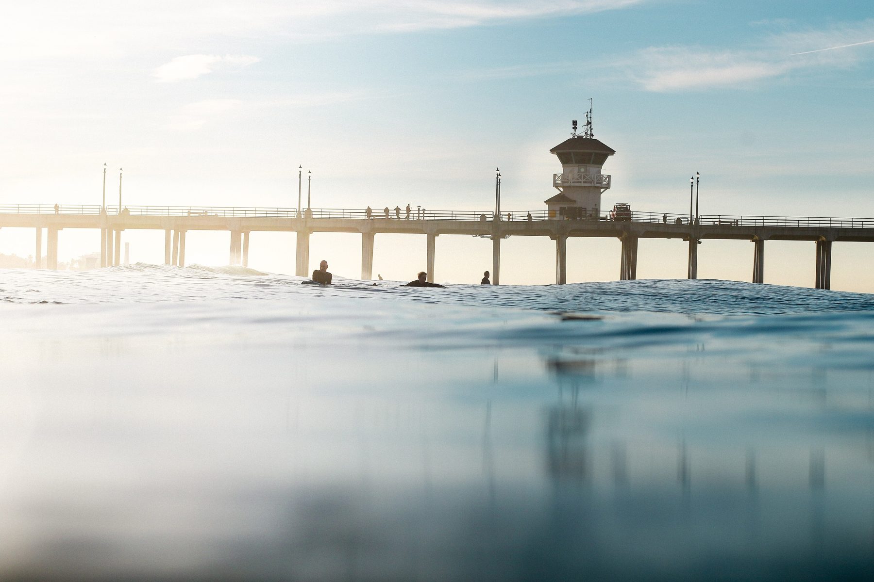 Colorful turquoise water beneath the Huntington Beach Pier
