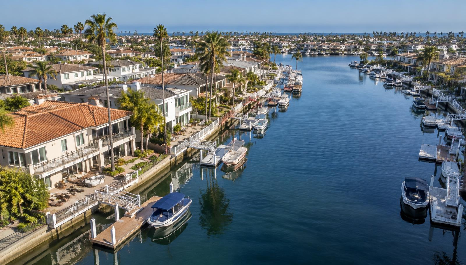 Waterfront homes, boats and private docks along the canals of Huntington Harbour in Huntington Beach, California